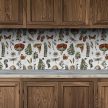 Decorative tile mural with mushrooms, ferns, wildflowers, dragonflies, butterfly and snail