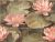 Decorative ceramic tile mural with pink water lilies and green lily pads on a tranquil water background