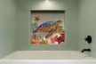 Decorative tile with colorful sea turtle and coral reef design