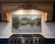 Tile mural with countryside lake scene, ducks, geese, and rustic cottages