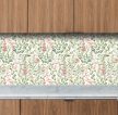 Watercolor botanical tile mural with green leaves, pink and white flowers, and small berries