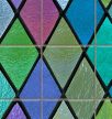 Colorful stained glass style tile mural with diamond shapes and black outlines