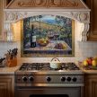 Impressionist ceramic tile mural with mediterranean landscape with rose arch, red wine bottle, fruit basket, grapes, and vineyards overlooking the sea