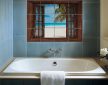 Tropical beach with palm tree seen through an open wooden window – exotic ceramic tile mural