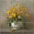 Ceramic tile mural with dandelions in a white vase, still life