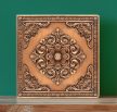 Ornate-ceramic-tile-with-embossed-copper-effect
