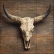 Tile mural with longhorn skull and wooden background
