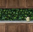 Tile mural covered in ivy leaves with dense green botanical pattern