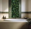 Tile mural covered in ivy leaves with dense green botanical pattern