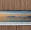 Ceramic tile mural of Badacsony at sunset with a rowing boat and lake reflections