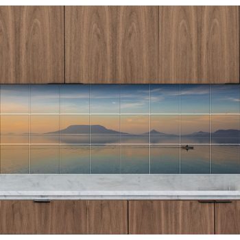 Ceramic tile mural of Badacsony at sunset with a rowing boat and lake reflections