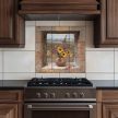 Tile mural with vase of sunflowers in stone window, with hills in background – rustic ceramic tile