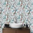 Chinoiserie tile mural with brown branches, pink and blue flowers, and decorative birds on light blue background