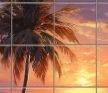 Tropical tile mural with palm trees and sunset on a serene beach