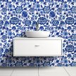 Chinoiserie-style ceramic tile mural with blue floral and leaf motifs on white background