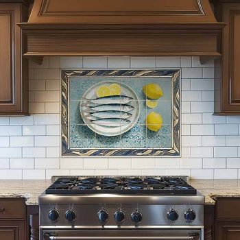 ceramic tile mural with sardines and lemon kitchen scene