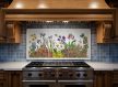 Tile mural with irises, wildflowers, mushrooms and butterflies