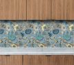 Stylized blue and beige floral ceramic tile mural
