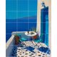 Mediterranean tile mural with blue-accented terrace, wine, table setting, and sea view