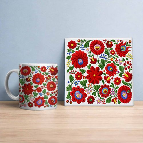 Matyó pattern tile trivet and ceramic mug with colorful Hungarian folk floral motifs