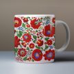 Matyó pattern tile trivet and ceramic mug with colorful Hungarian folk floral motifs